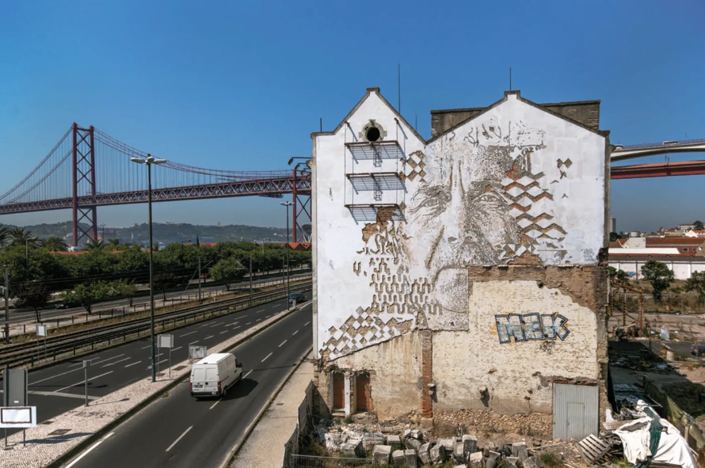 A carved Vhils wall in Lisbon