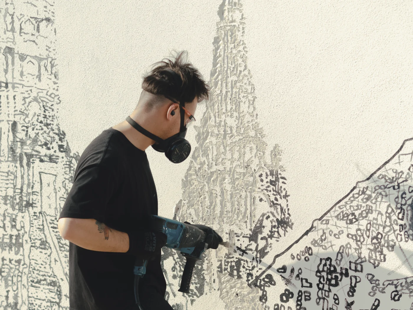 Alexandre Farto (Vhils) carving a wall